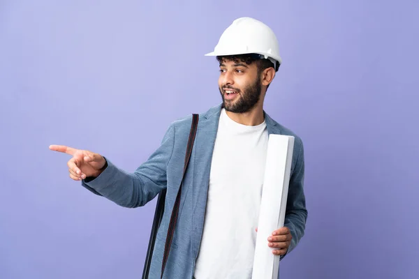 Young Architect Moroccan Man Helmet Holding Blueprints Isolated Background Pointing — 스톡 사진