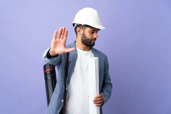 Young Architect Moroccan Man Helmet Holding Blueprints Isolated Background Making — Fotografia de Stock