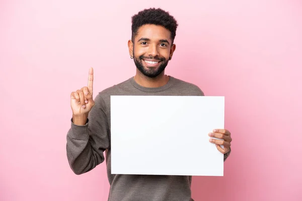 Young Brazilian Man Isolated Pink Background Holding Empty Placard Pointing — Φωτογραφία Αρχείου
