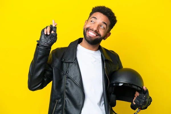 Young Brazilian Man Motorcycle Helmet Isolated Yellow Background Fingers Crossing — 스톡 사진