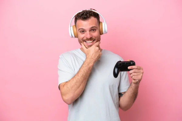 Young Brazilian Man Playing Video Game Controller Isolated Pink Background — Zdjęcie stockowe