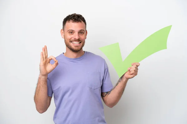 Young Brazilian Man Isolated White Background Holding Check Icon Doing — Stock fotografie