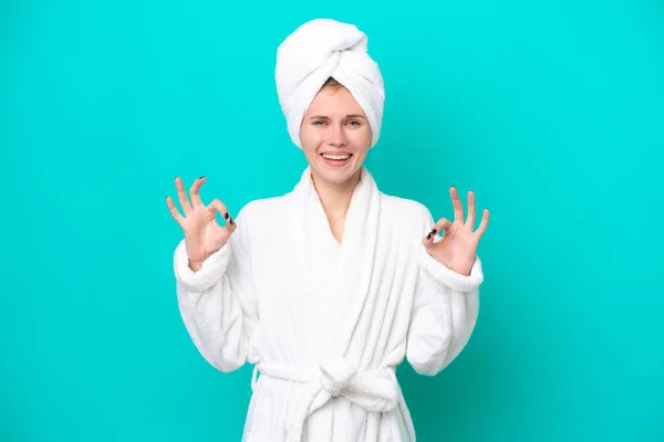 Young Woman Bathrobe Isolated Blue Background Showing Sign Fingers — 图库照片
