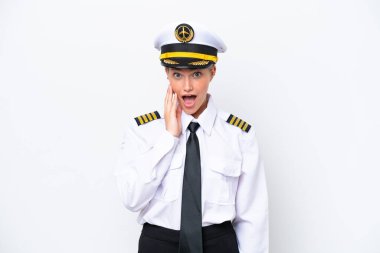 Airplane caucasian pilot woman isolated on white background with surprise and shocked facial expression