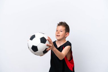 Boy playing football over isolated white wall