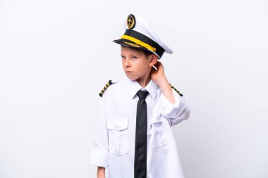 Little airplane pilot boy isolated on white background having doubts