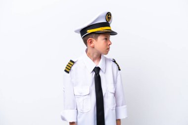 Little airplane pilot boy isolated on white background looking to the side