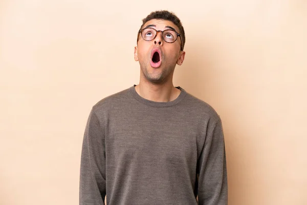 Young Brazilian Man Isolated Beige Background Looking Surprised Expression — Fotografia de Stock