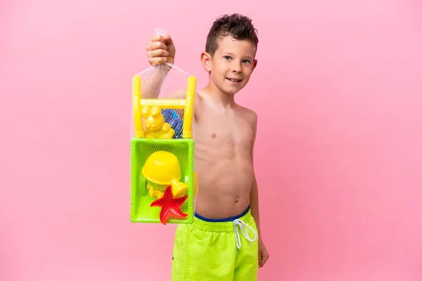 Little Caucasian Boy Holding Beach Toys Isolated Pink Background Happy — Stockfoto
