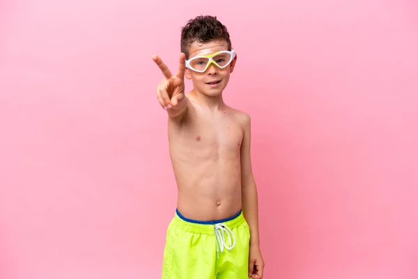 Little Caucasian Boy Wearing Diving Goggles Isolated Pink Background Smiling — 스톡 사진