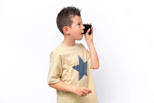 Little Caucasian Boy Isolated White Background Keeping Conversation Mobile Phone — Stock Photo, Image