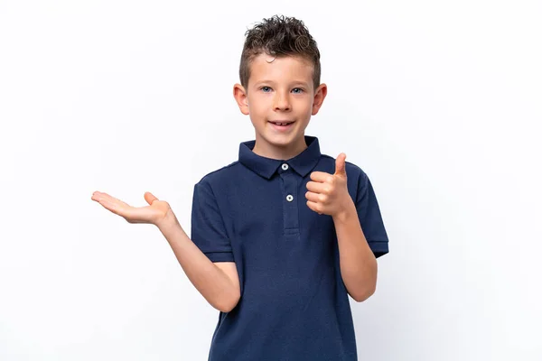 Little Caucasian Boy Isolated White Background Holding Copyspace Imaginary Palm — Stockfoto