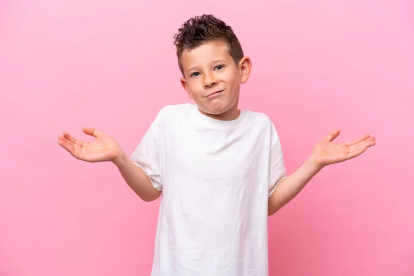 Little Caucasian Boy Isolated Pink Background Having Doubts While Raising — Foto Stock