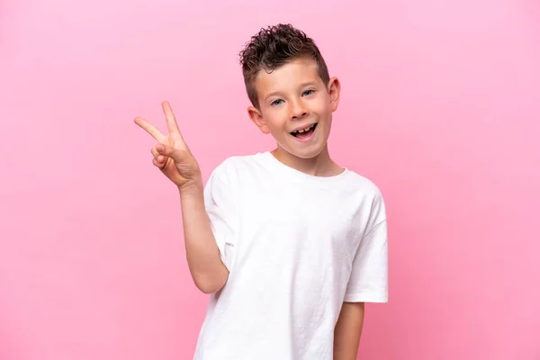 Little Caucasian Boy Isolated Pink Background Smiling Showing Victory Sign —  Fotos de Stock