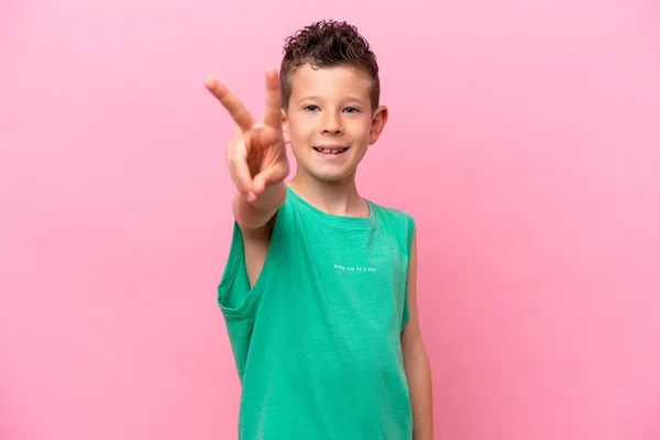 Little Caucasian Boy Isolated Pink Background Smiling Showing Victory Sign —  Fotos de Stock