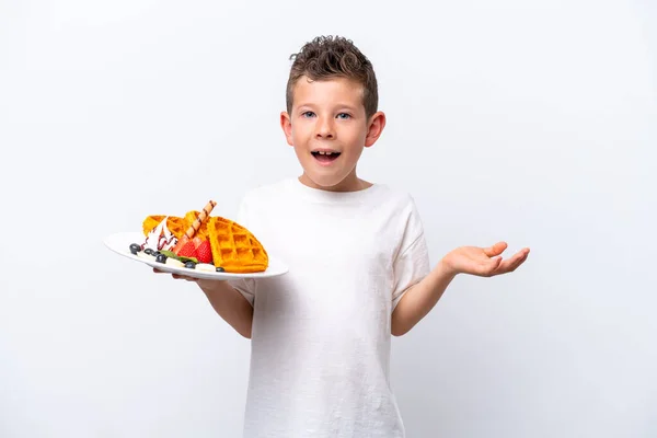 Little Caucasian Boy Holding Waffles Isolated White Background Shocked Facial — Stockfoto
