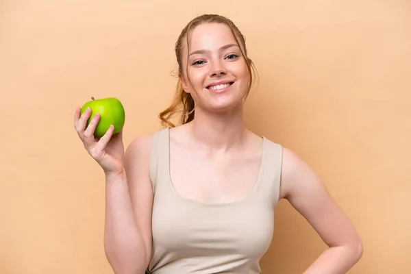 Young Caucasian Girl Isolated Beige Background Apple Happy — Stock Fotó