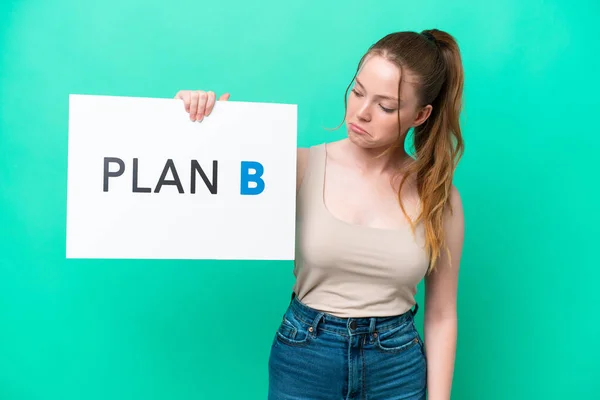 Young Caucasian Woman Isolated Green Background Holding Placard Message Plan — Stock Photo, Image