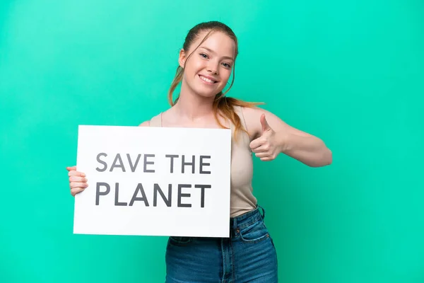 Young Caucasian Woman Isolated Green Background Holding Placard Text Planet — ストック写真