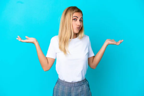 Blonde Uruguayan Girl Isolated Blue Background Making Doubts Gesture — Photo