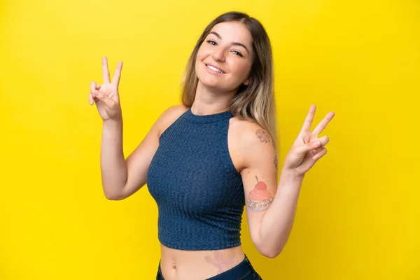 Young Rumanian Woman Isolated Yellow Background Showing Victory Sign Both – stockfoto