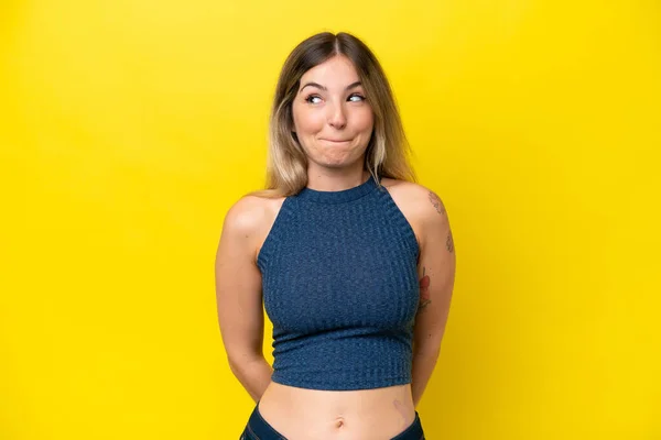 Young Rumanian Woman Isolated Yellow Background Having Doubts While Looking — Stock Photo, Image