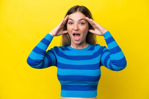 Young Rumanian Woman Isolated Yellow Background Surprise Expression — Stock Fotó