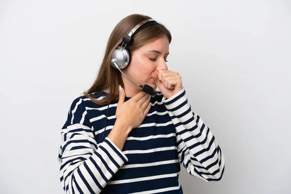 Telemarketer caucasian woman working with a headset isolated on white background is suffering with cough and feeling bad