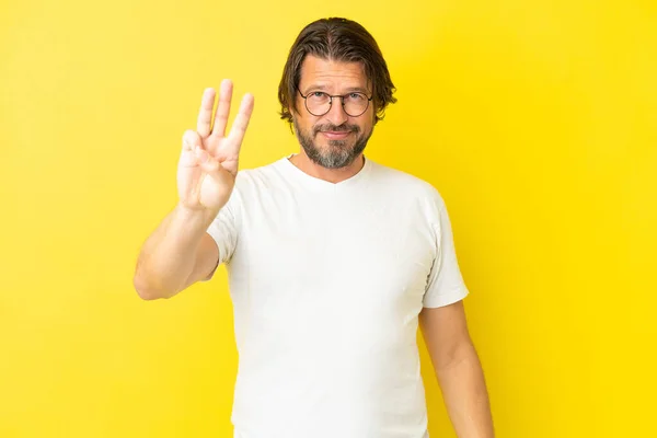 Senior Dutch Man Isolated Yellow Background Happy Counting Three Fingers — ストック写真