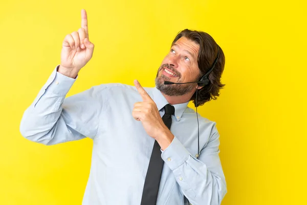 Telemarketer Dutch Man Working Headset Isolated Yellow Background Pointing Index — Stock Photo, Image