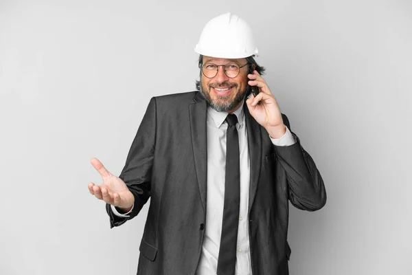Young Architect Man Helmet Isolated Background Keeping Conversation Mobile Phone — ストック写真