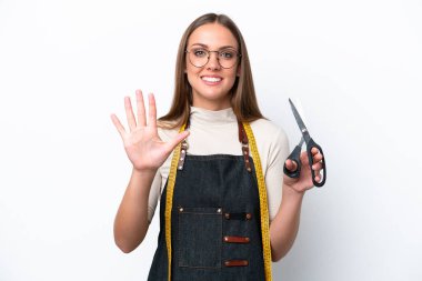 Young seamstress woman isolated on white background counting five with fingers