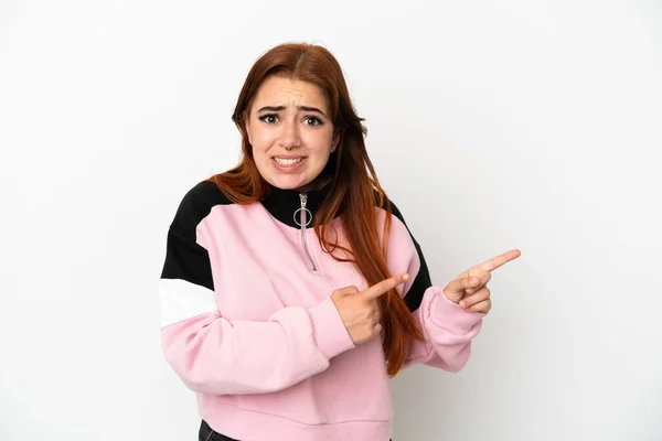 Young Redhead Woman Isolated White Background Frightened Pointing Side — 스톡 사진