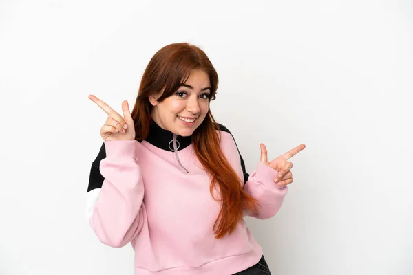 Young Redhead Woman Isolated White Background Pointing Finger Laterals Happy — Fotografia de Stock