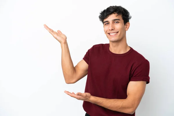 Young Argentinian Man Isolated White Background Extending Hands Side Inviting — Stockfoto