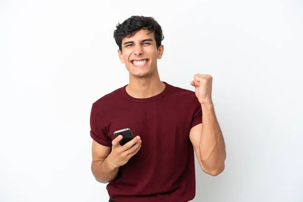 Young Argentinian Man Isolated White Background Phone Victory Position — 스톡 사진