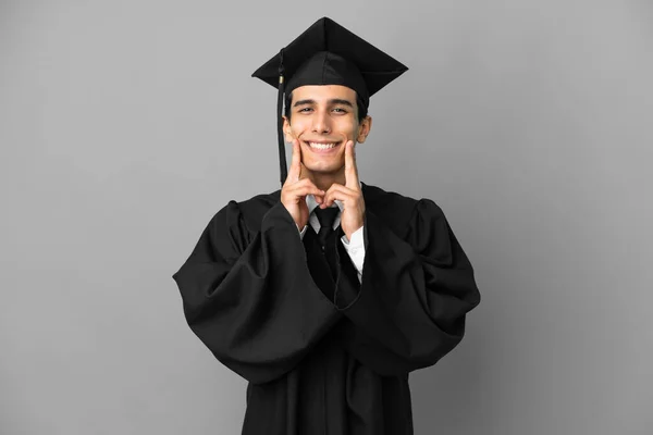 Junger Argentinischer Universitätsabsolvent Isoliert Auf Grauem Hintergrund Lächelnd Mit Fröhlichem — Stockfoto