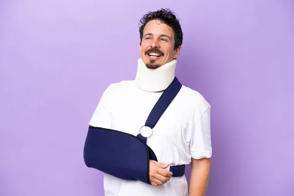 Young Caucasian Man Wearing Sling Neck Brace Isolated Purple Background — Stockfoto