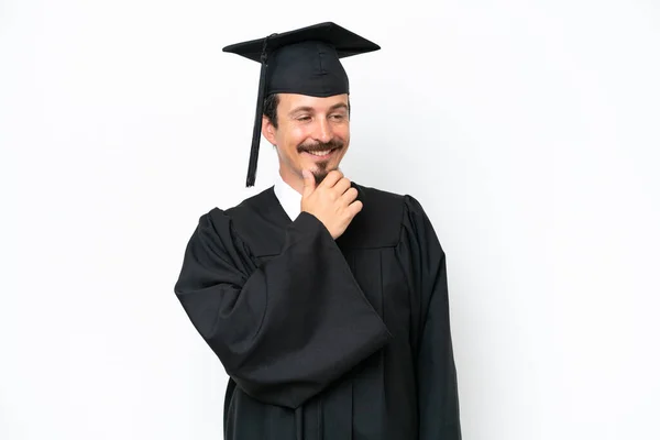 Young University Graduate Man Isolated White Background Looking Side — Stock Fotó