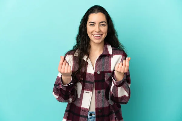 Young Caucasian Woman Isolated Blue Background Making Money Gesture — Stock Photo, Image
