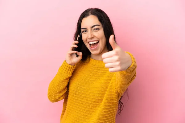 Young Caucasian Woman Using Mobile Phone Isolated Pink Background Thumbs —  Fotos de Stock