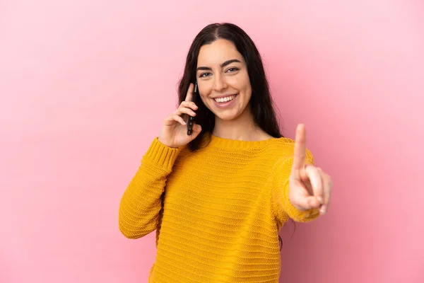 Young Caucasian Woman Using Mobile Phone Isolated Pink Background Showing —  Fotos de Stock
