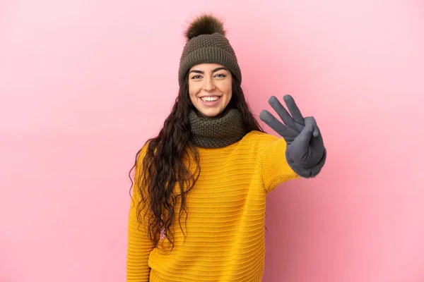 Young Caucasian Girl Winter Hat Isolated Purple Background Happy Counting — Zdjęcie stockowe