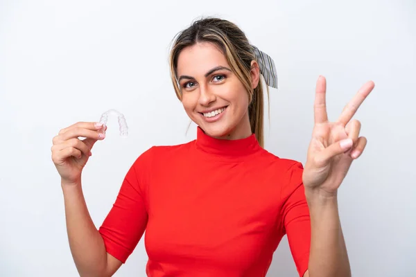 Young Caucasian Woman Holding Invisible Braces White Background Smiling Showing — 图库照片