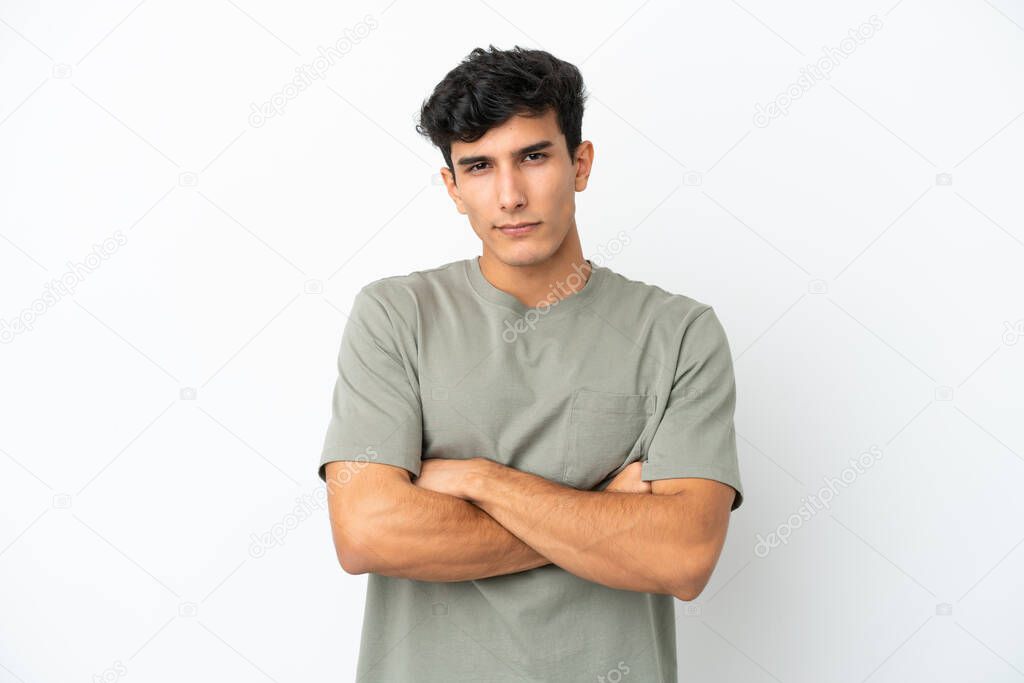 Young Argentinian man isolated on white background with unhappy expression