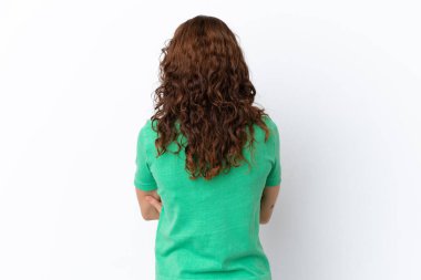 Young woman with curly hair isolated on white background in back position