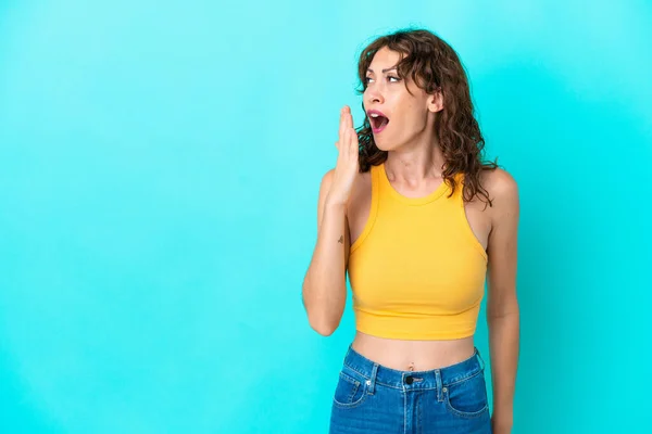 Young Woman Curly Hair Isolated Blue Background Yawning Covering Wide — стоковое фото
