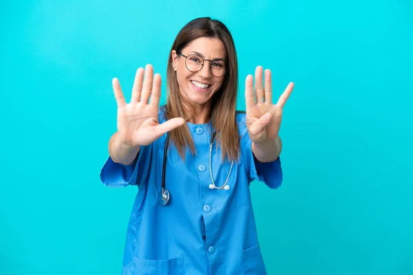 Middle Age Surgeon Woman Isolated Blue Background Counting Nine Fingers — Stok fotoğraf
