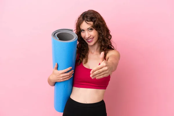 Young Sport Woman Going Yoga Classes While Holding Mat Isolated — 图库照片