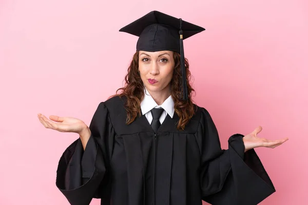 Young University Graduate Woman Isolated Pink Background Having Doubts While — стоковое фото